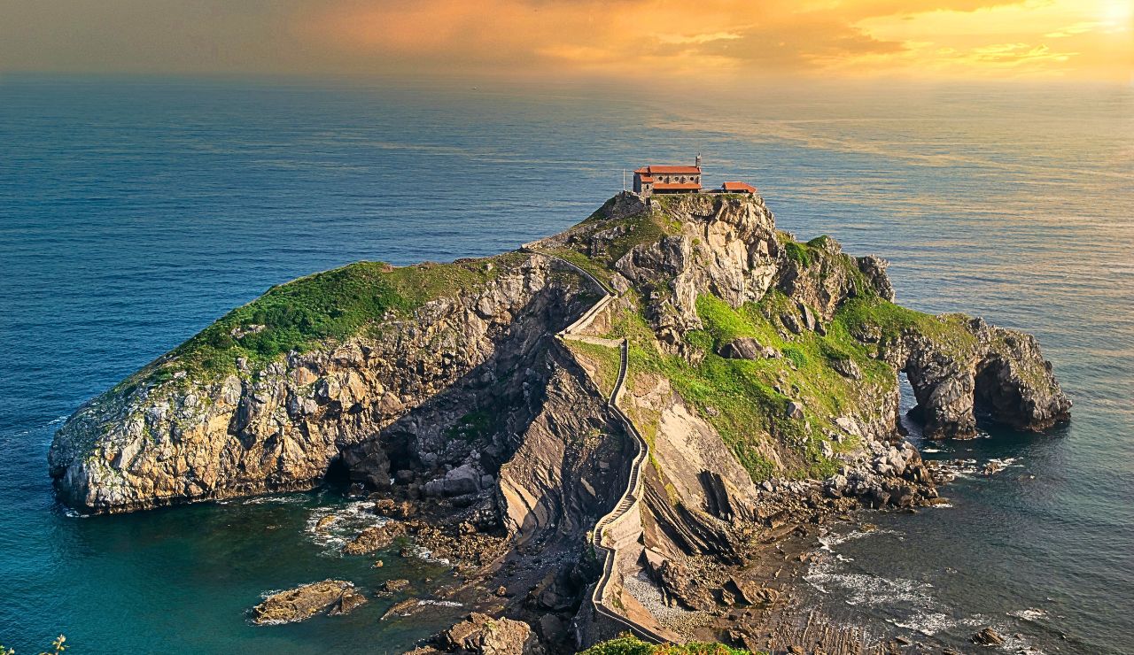 Rocky island chapel linked to the mainland by a stone bridge