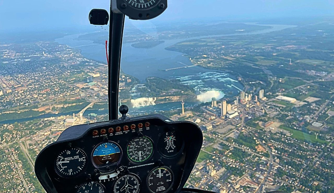 Aerial view of all three Niagara Falls and the winding Niagara River.
