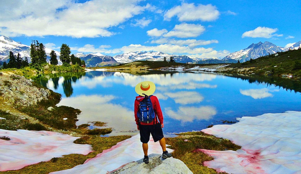 Rugged Canadian Rockies surrounding a crystal-clear alpine lake.