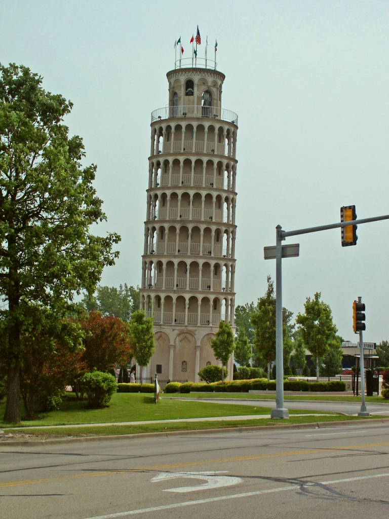Leaning Tower of Niles in Illinois, a half-size replica of Italy’s Leaning Tower of Pisa, surrounded by a fountain and flags atop the structure.