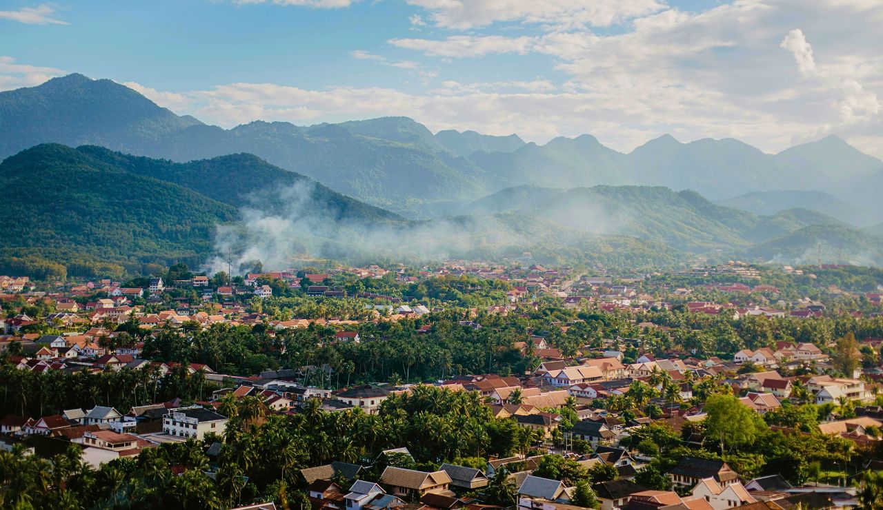 Luang Prabang with temple rooftops and river backdrop