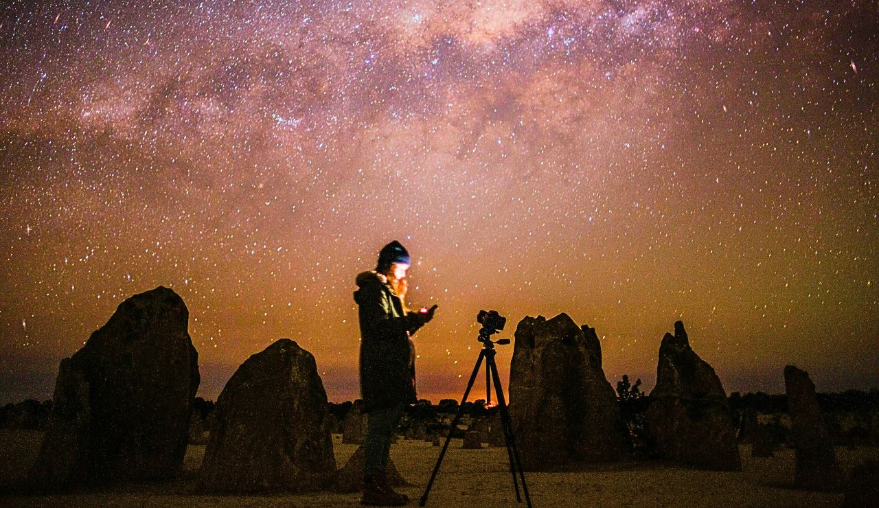 Camera on tripod capturing stars at Mauna Kea