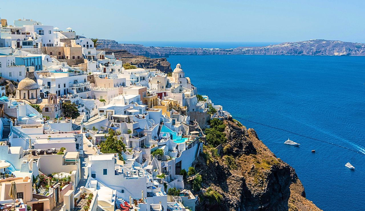 Peaceful beach and white-washed houses in Naxos, Greece.