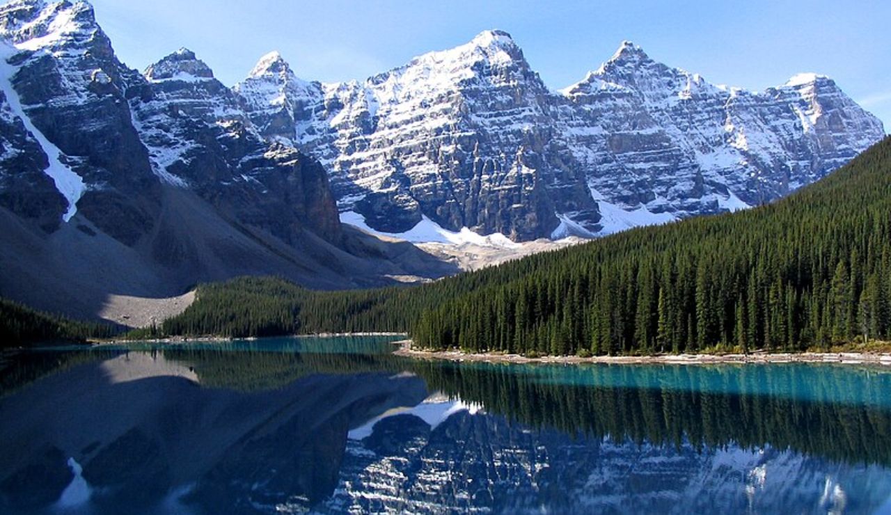 Snow-capped peaks reflected in the turquoise waters of Moraine Lake, Banff National Park, Canada.