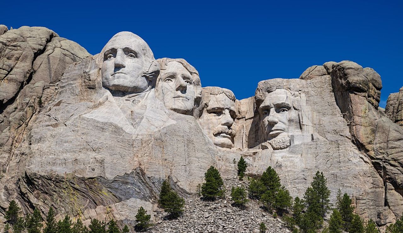 Mount Rushmore National Memorial featuring the carved faces of four U.S. presidents under a clear blue sky in South Dakota