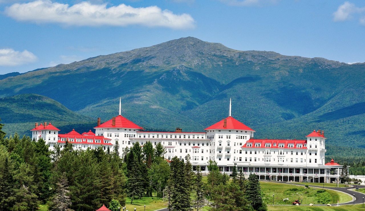 Historic Mount Washington Hotel in New Hampshire with mountain backdrop