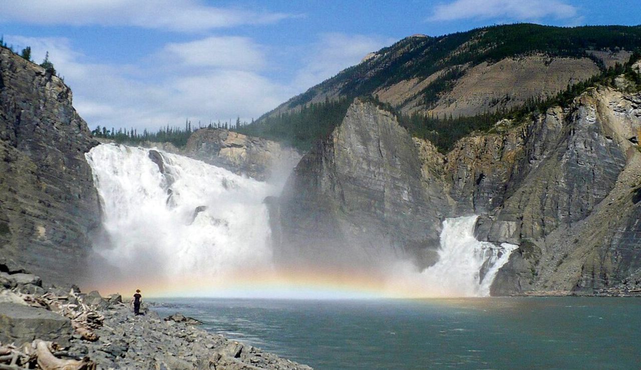 Powerful waterfall with a rainbow at Virginia Falls in Nahanni National Park, Northwest Territories, Canada.