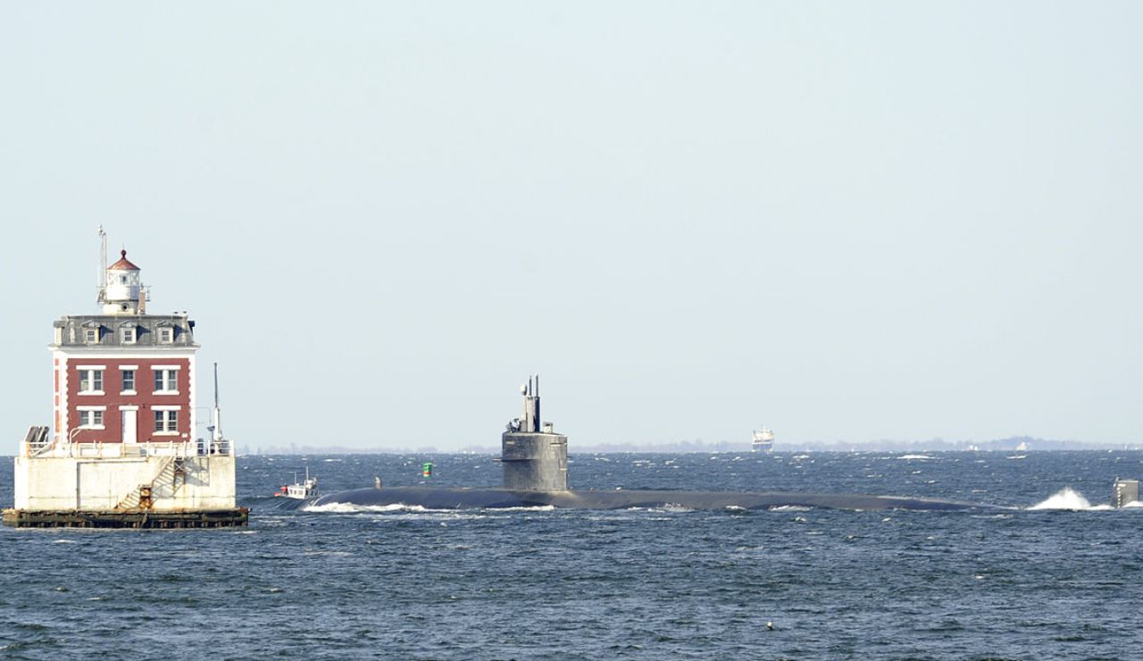 Submarine passing by New London Ledge Lighthouse on Long Island Sound, Connecticut.