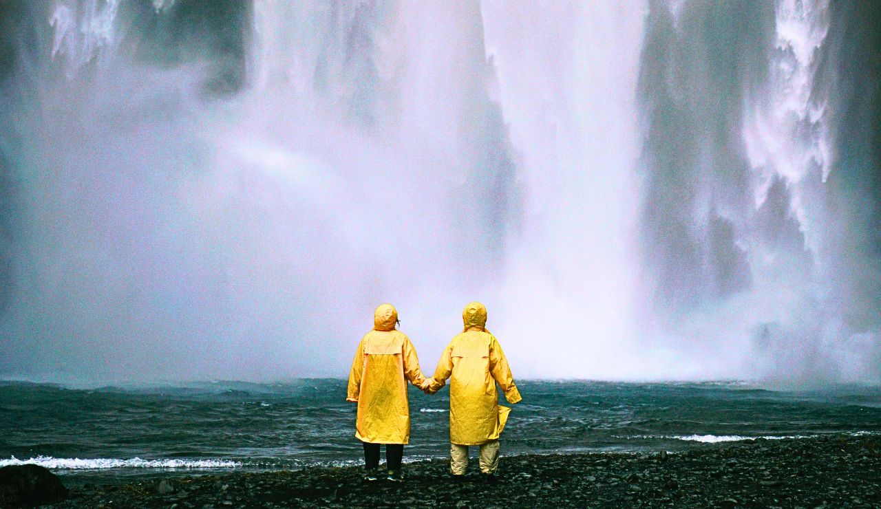 Scenic overlook of Niagara Falls with mist rising and water cascading in full view.