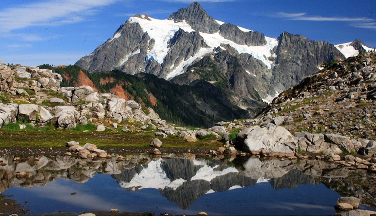 Mount Shuksan reflected in an alpine lake in North Cascades National Park, Washington.