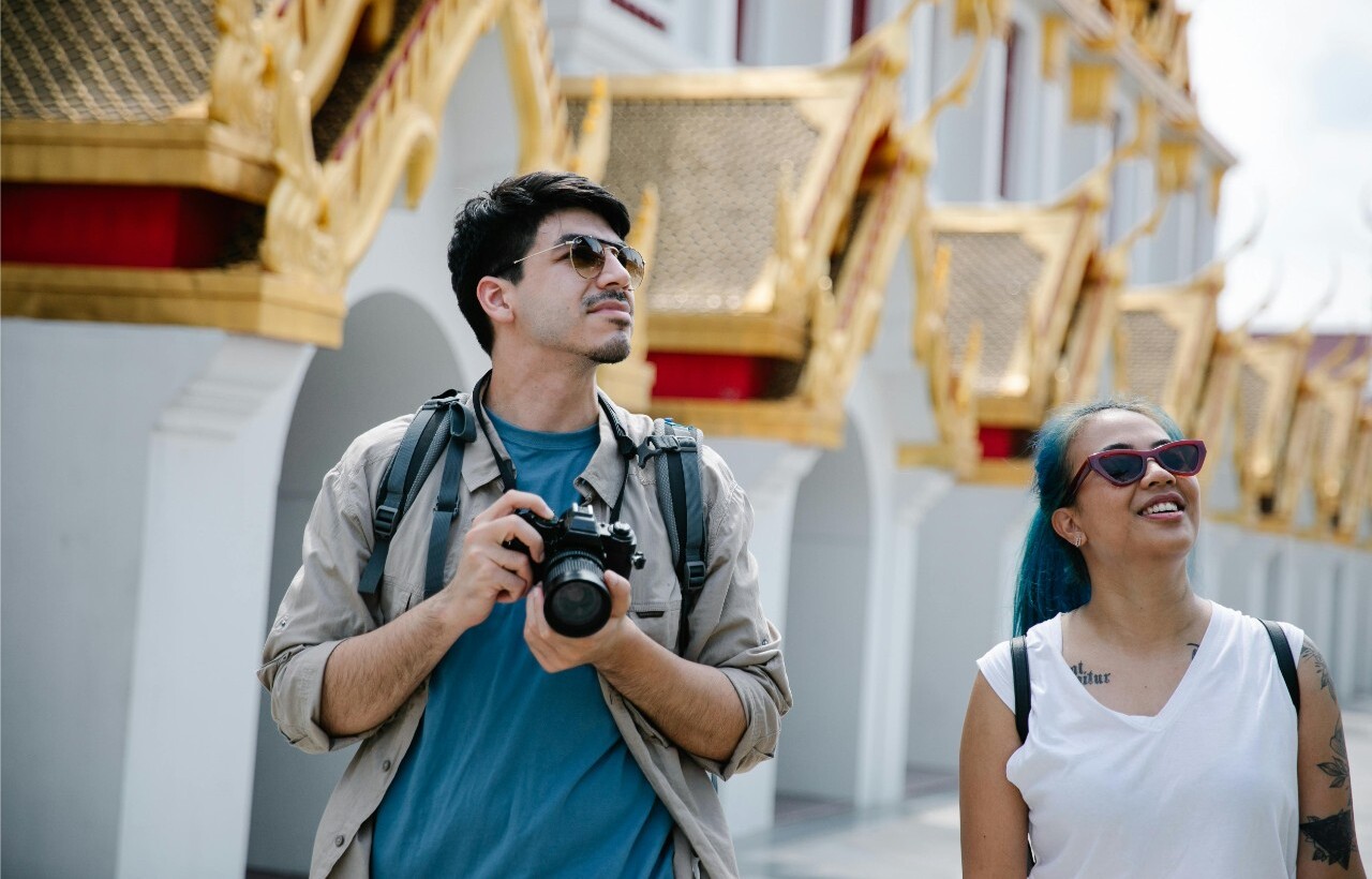 Tourists exploring a temple in Bangkok.