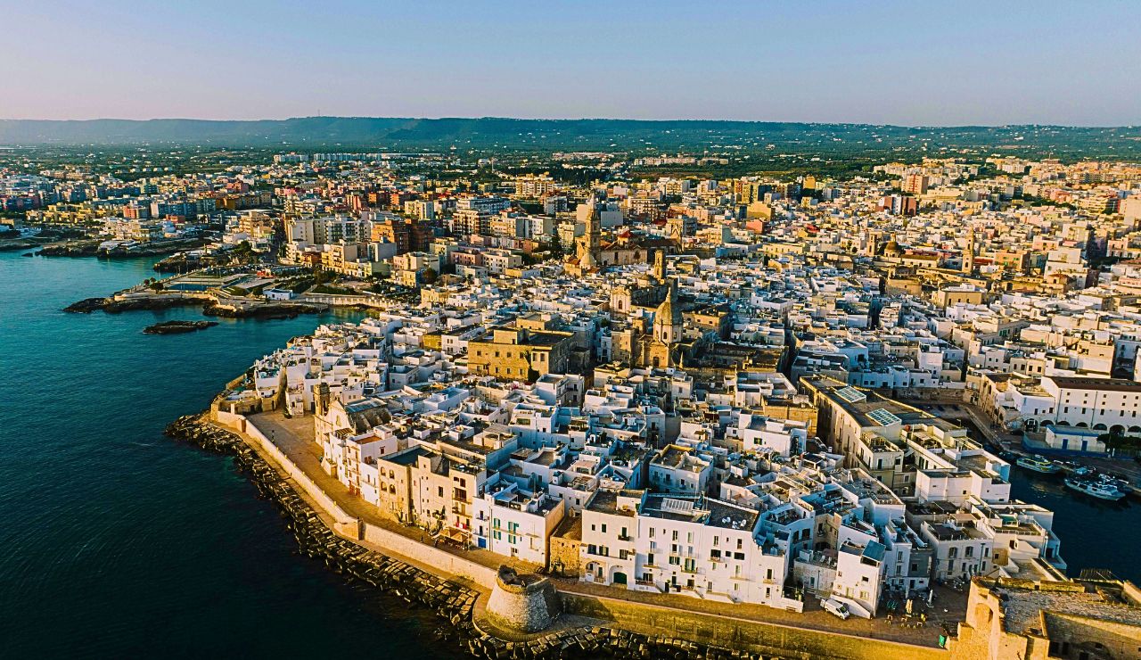 Whitewashed buildings by the sea in Italy.