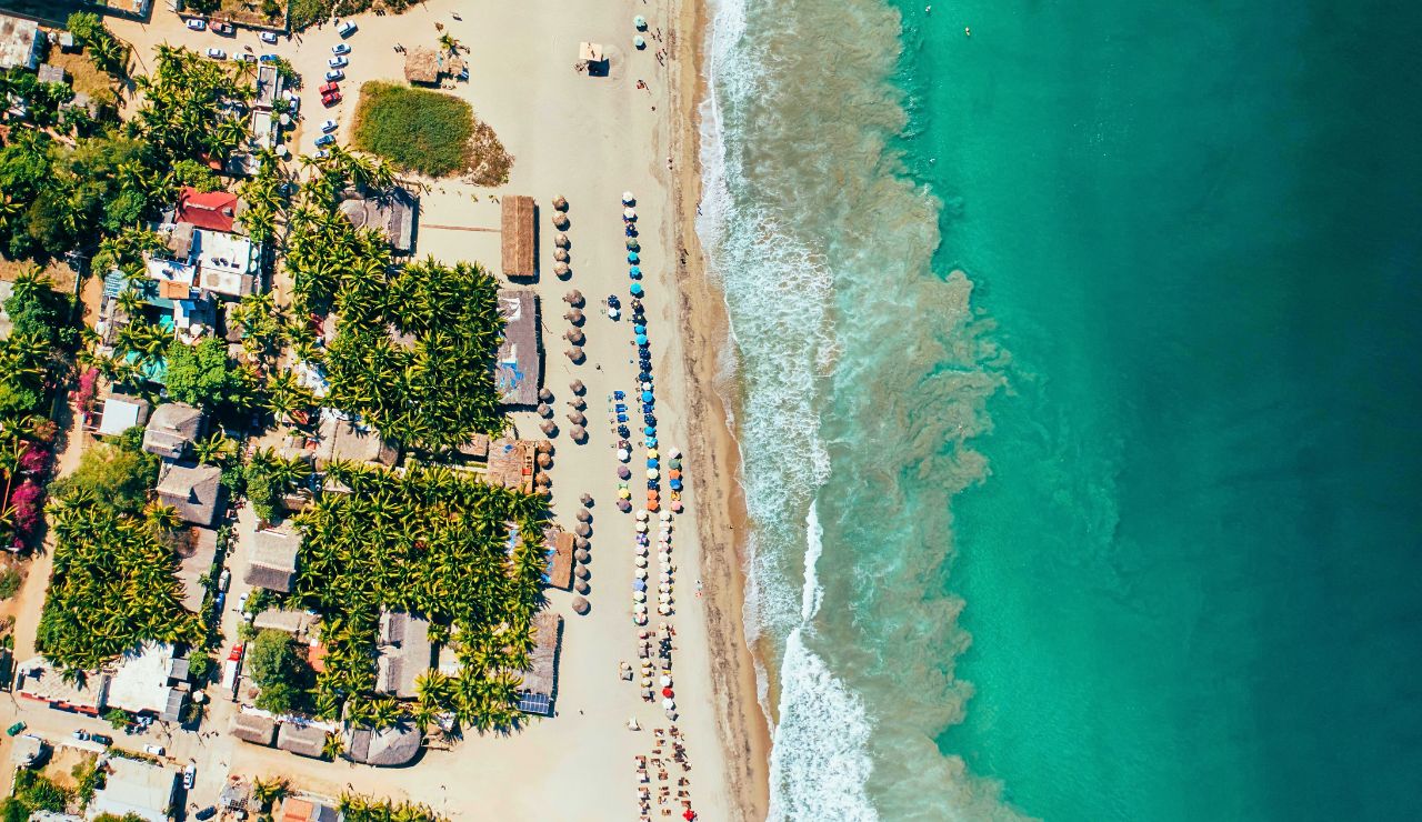 Sayulita beach with surfboards and colorful village streets