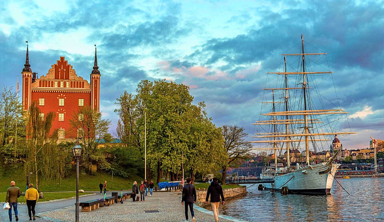 Boats docked near historic buildings on Stockholm’s waterfront.