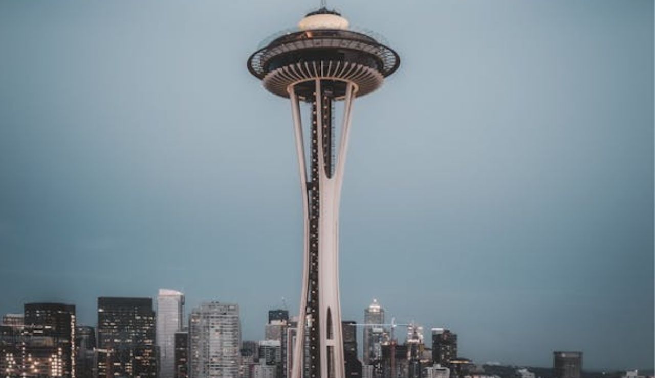 Evening view of Seattle's Space Needle towering over the city skyline under a twilight sky