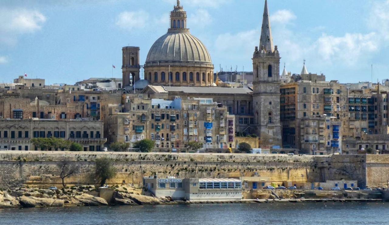 Scenic waterfront view of Valletta with St. Paul's Cathedral dome, Malta.