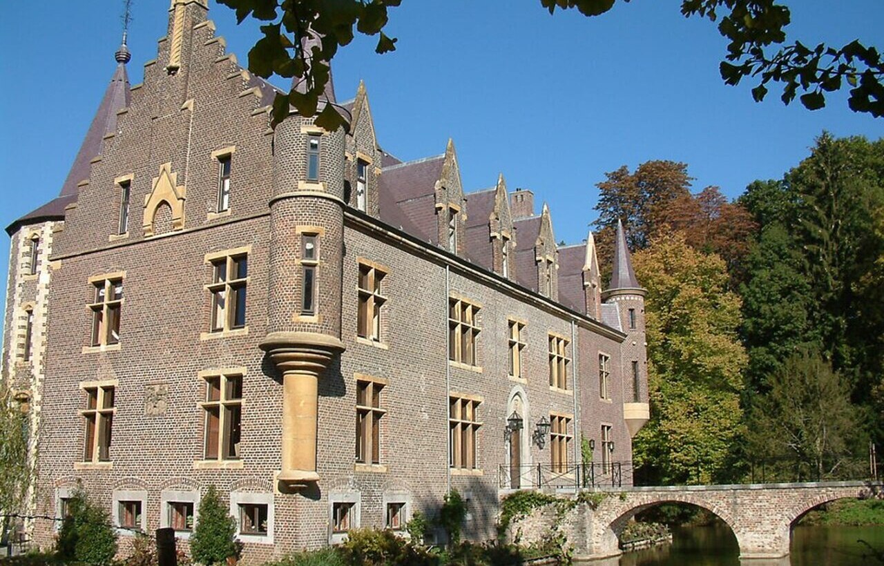 Kasteel TerWorm brick castle with arched bridge in Heerlen, Netherlands.