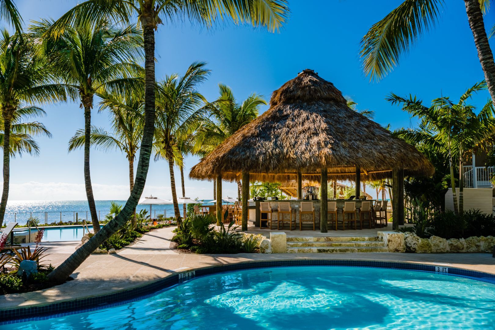 Tiki hut and pool area with views of the ocean at Cheeca Lodge and Spa.
