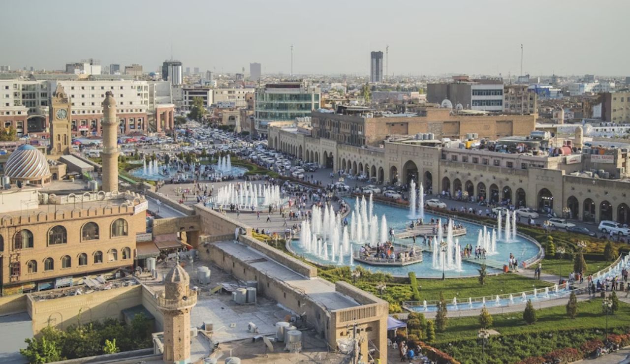 Erbil Citadel Square, Iraq – Historic charm meets lively fountains and bustling streets.