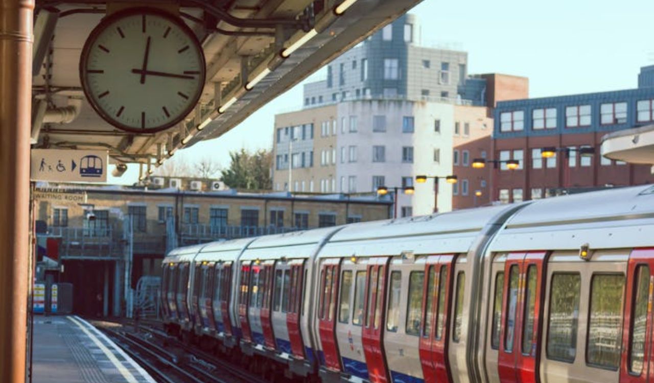 Train at a city metro station platform during the day, highlighting the importance of using public transportation while traveling