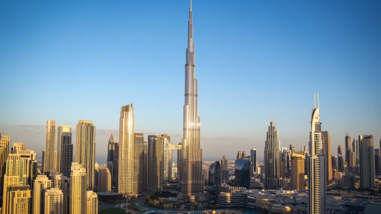 Skyline of Dubai featuring the Burj Khalifa at sunset.