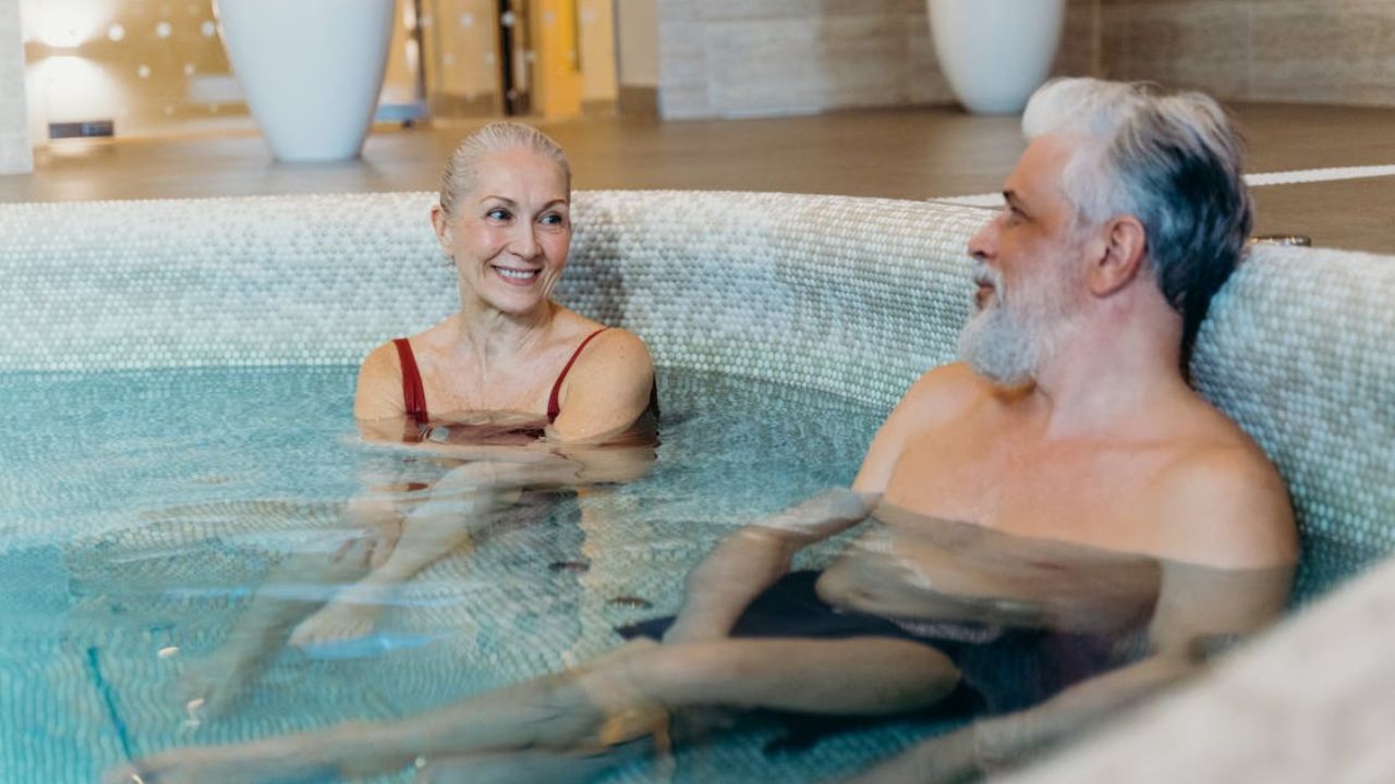 Relaxed couple enjoying a peaceful spa soak together