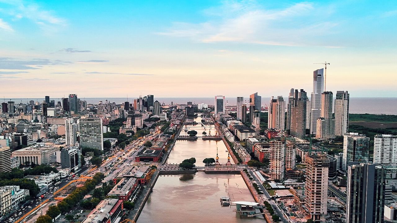 Buenos Aires skyline with river and tall buildings at sunset