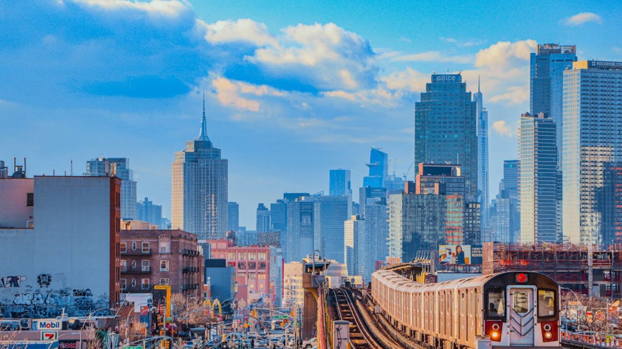Subway train entering vibrant cityscape