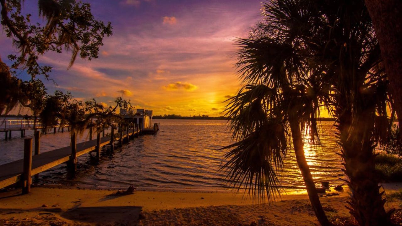 Indian River Lagoon, Florida – Palms, golden skies, and tranquil waters.