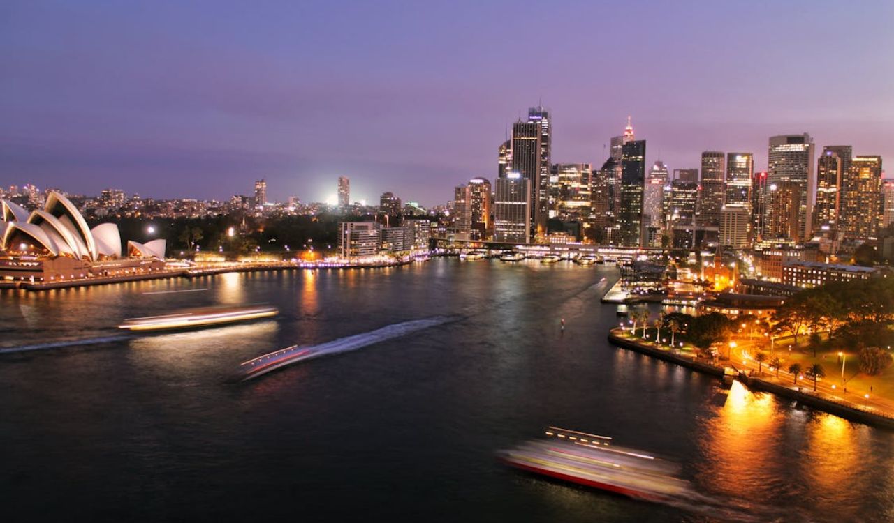 Night view of Sydney Harbour with Opera House and city skyline, Australia