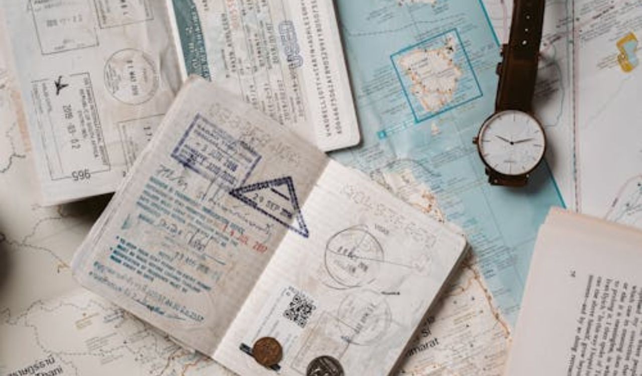 Passport with stamps, maps, and travel items