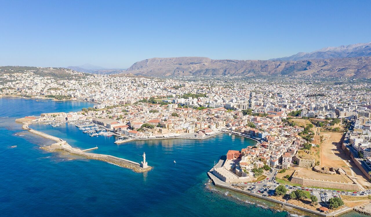 Aerial view of Chania, Crete in Greece with Venetian harbor and lighthouse