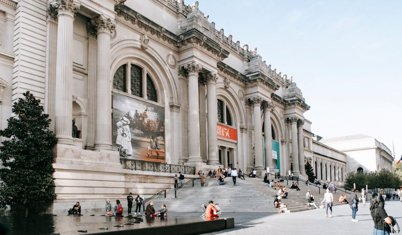 Visitors relaxing on steps outside the Metropolitan Museum of Art in New York City