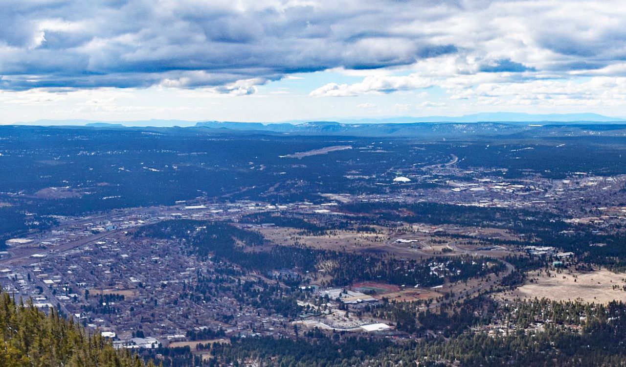 Flagstaff spreads beneath vast pine forests