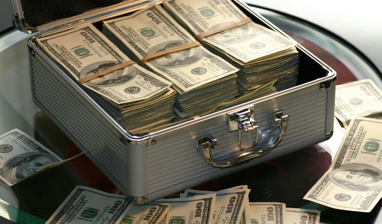 Briefcase full of stacked U.S. hundred-dollar bills