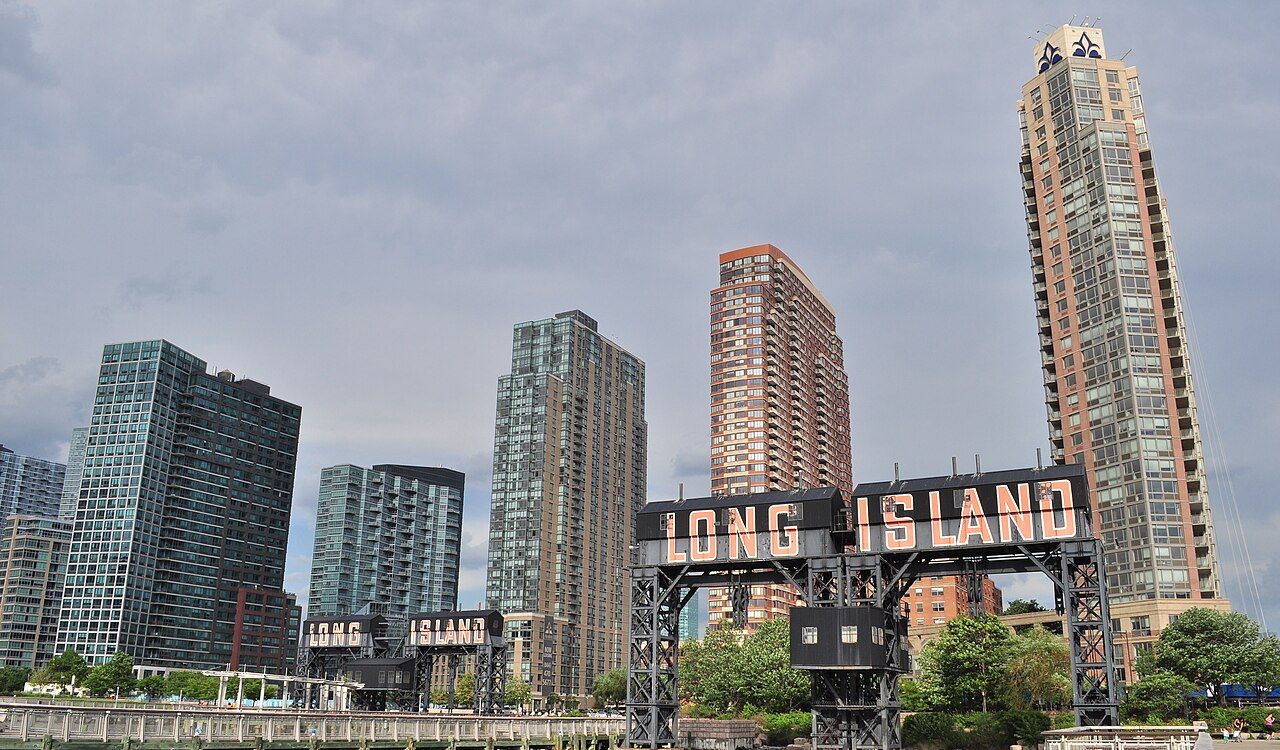 Long Island sign with modern skyscrapers
