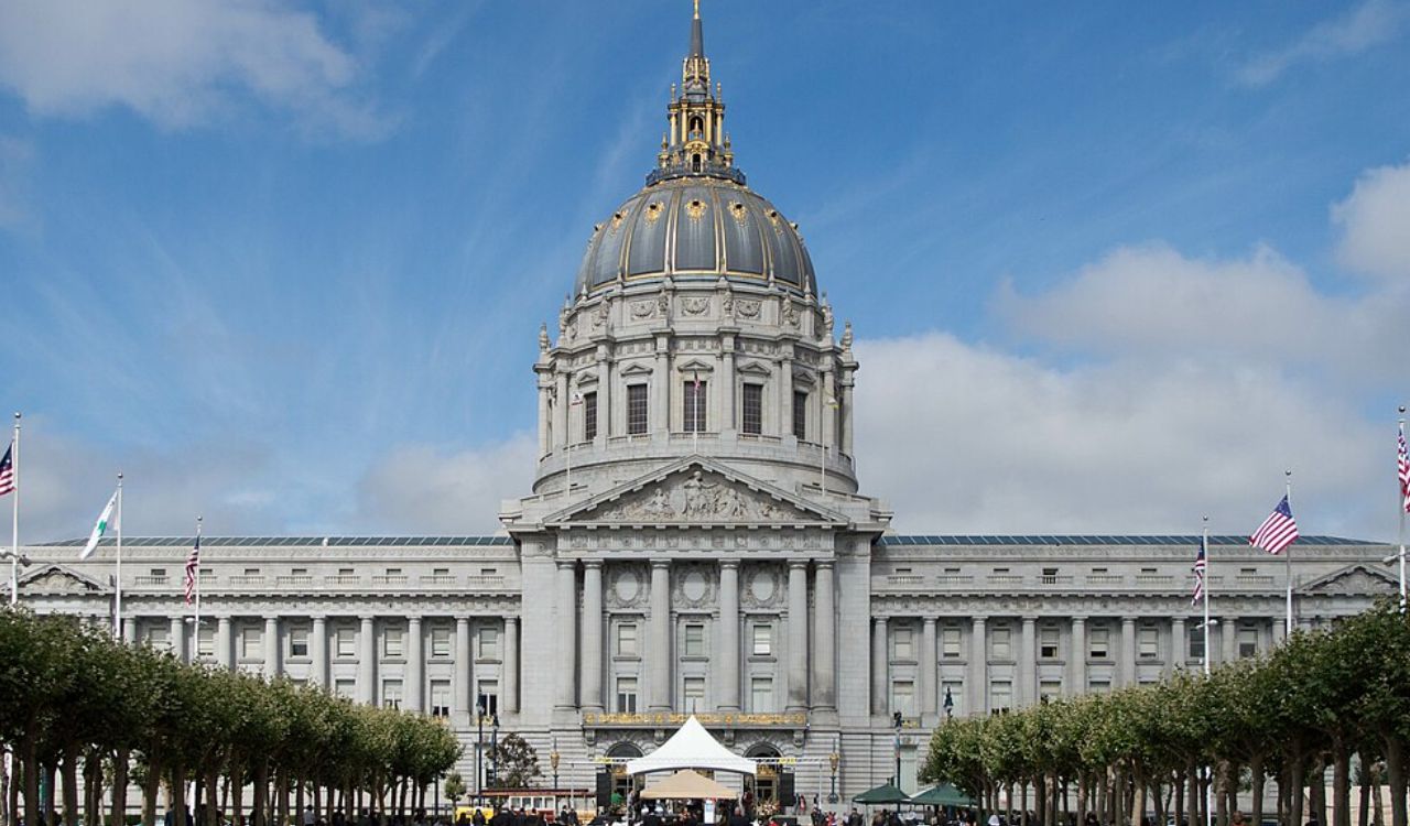 San Francisco City Hall with its grand dome and surrounding trees.