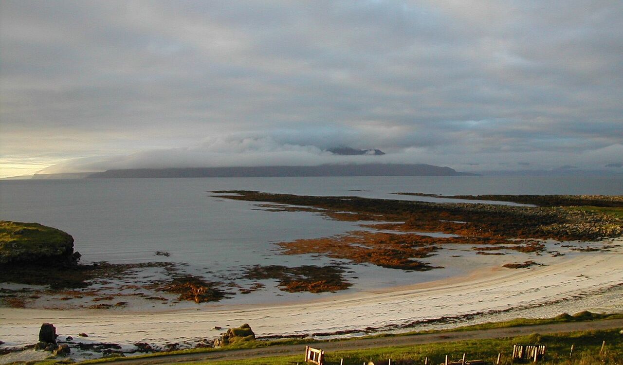 Cloudy sky over the calm coast of the Isle of Muck