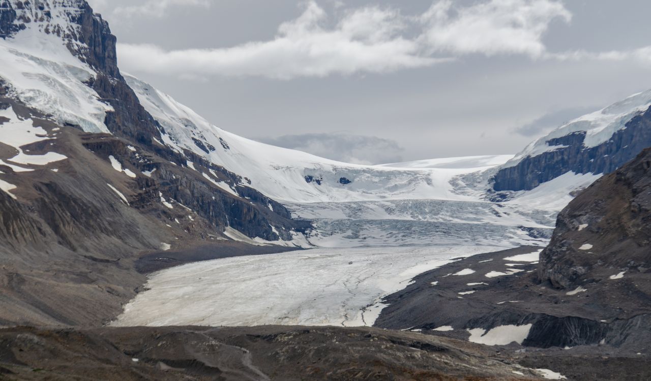 Athabasca Glacier between snowy peaks in Jasper National Park.