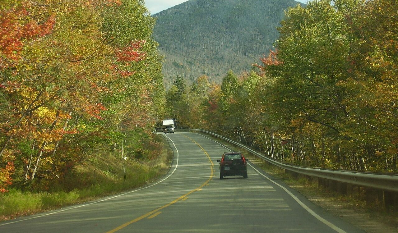 Kancamagus Highway offers stunning fall foliage and peaceful mountain views, perfect for a scenic drive