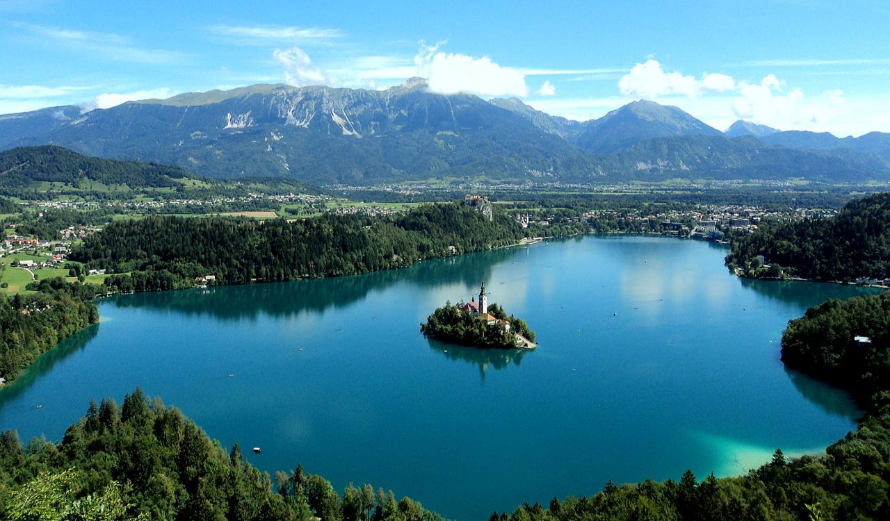 Lake Bled in Slovenia with island church and alpine mountain backdrop