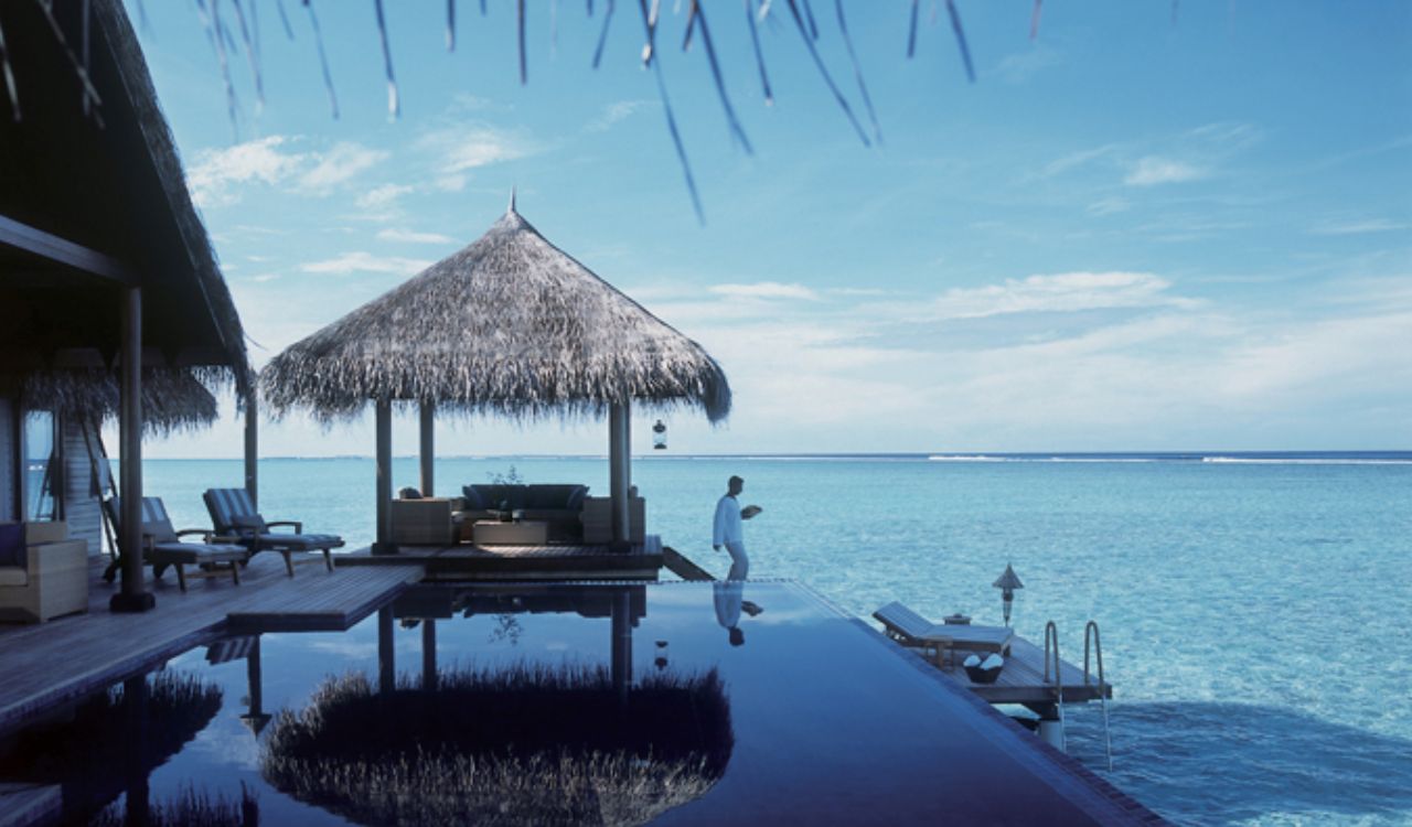 Luxury overwater villa with ocean view and infinity pool in the Maldives