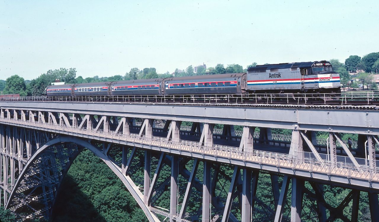 Amtrak train crossing a scenic bridge en route to Niagara Falls