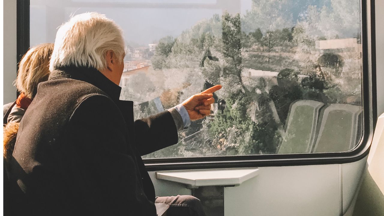 MSNPS-Old mature grey haired couple pensioner travel by train