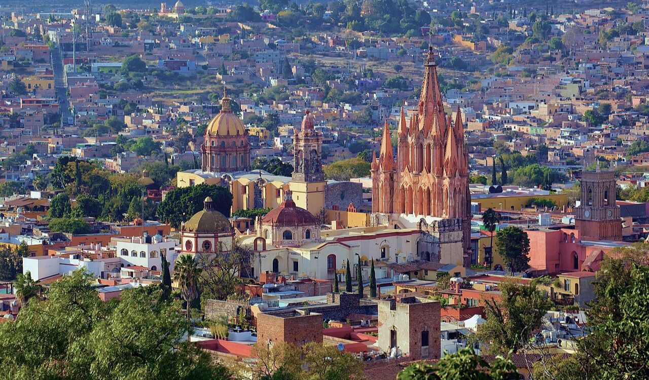 San Miguel de Allende cityscape with colorful buildings and a striking Gothic-style church