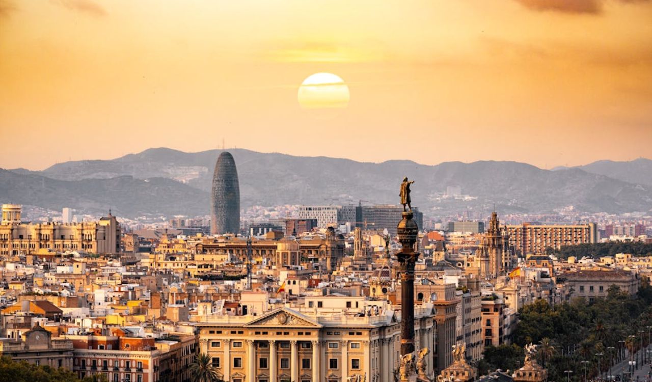 Barcelona’s skyline glows under golden sunset