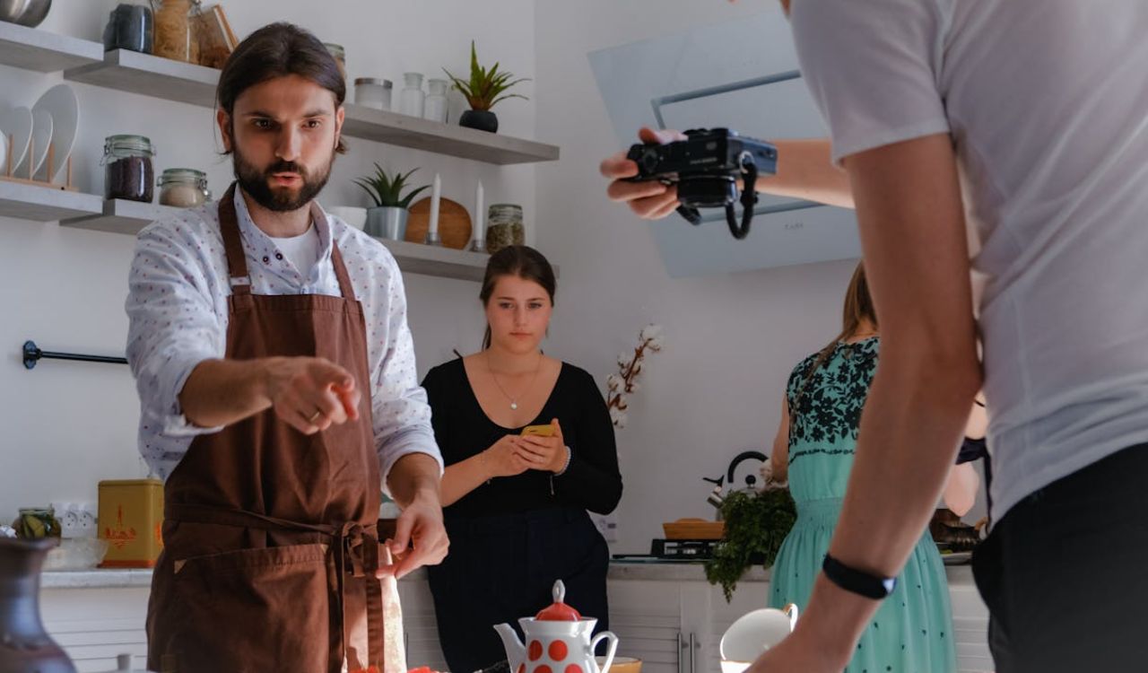 Travelers filming and joining a local cooking class experience