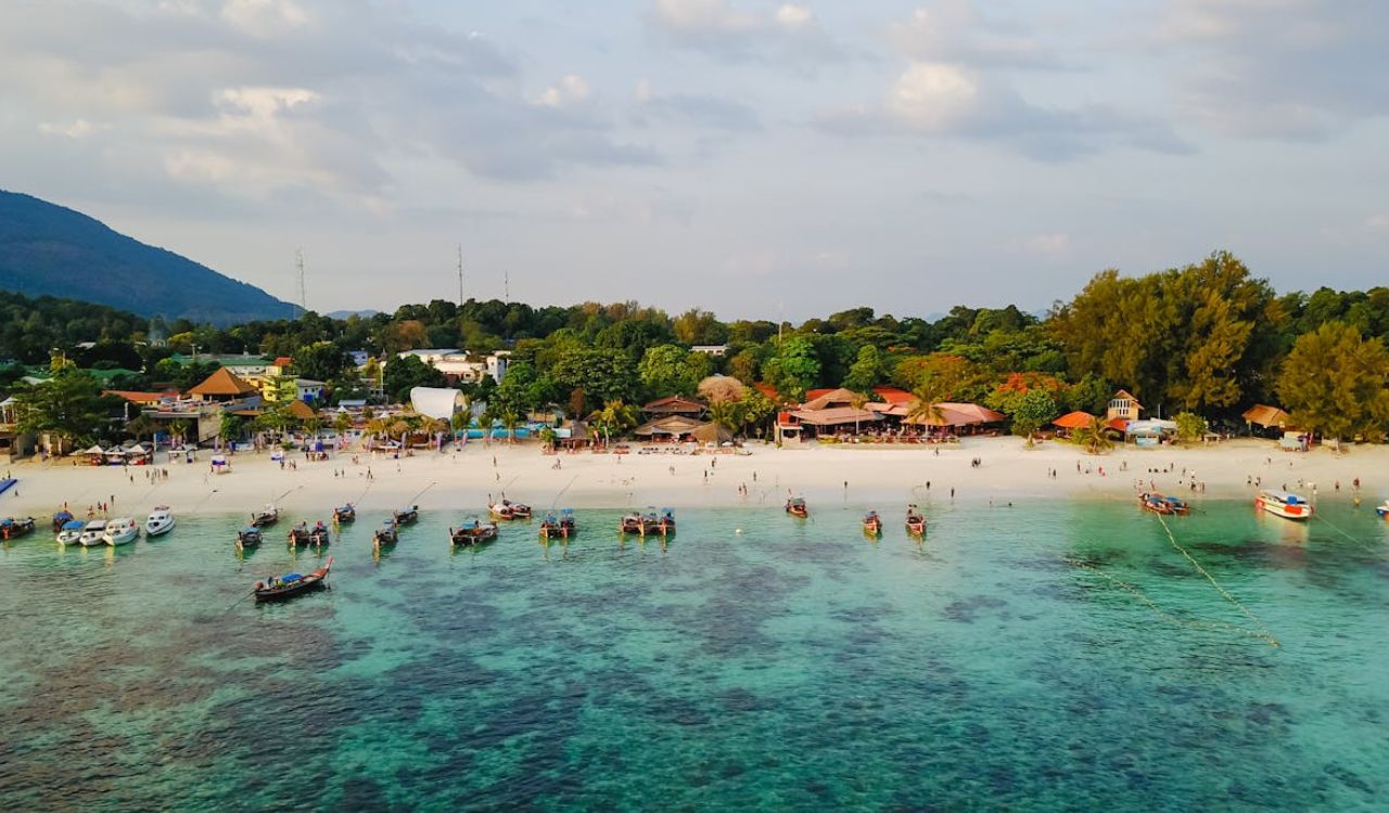 Boats float gently near Thailand’s shore