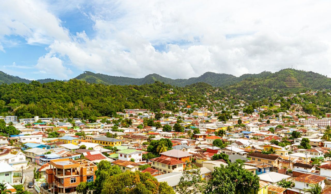 Colorful homes blanket the hills of Trinidad and Tobago, nestled beneath lush, tropical mountains