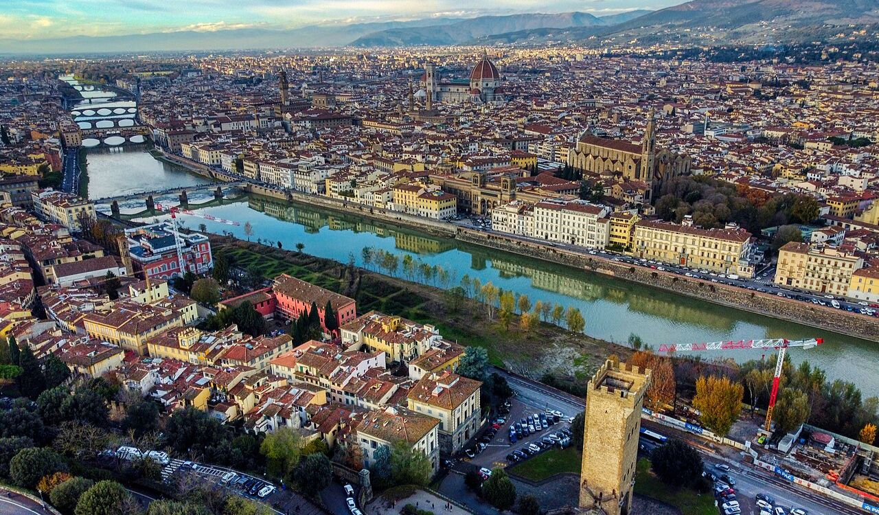 "Aerial view of Florence, Tuscany, showing the Arno River and historic cityscape,